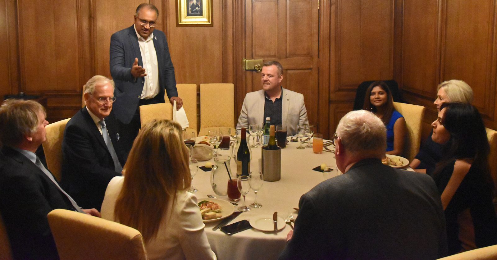 Safaraz Ali MBE addressing guests at a business dinner