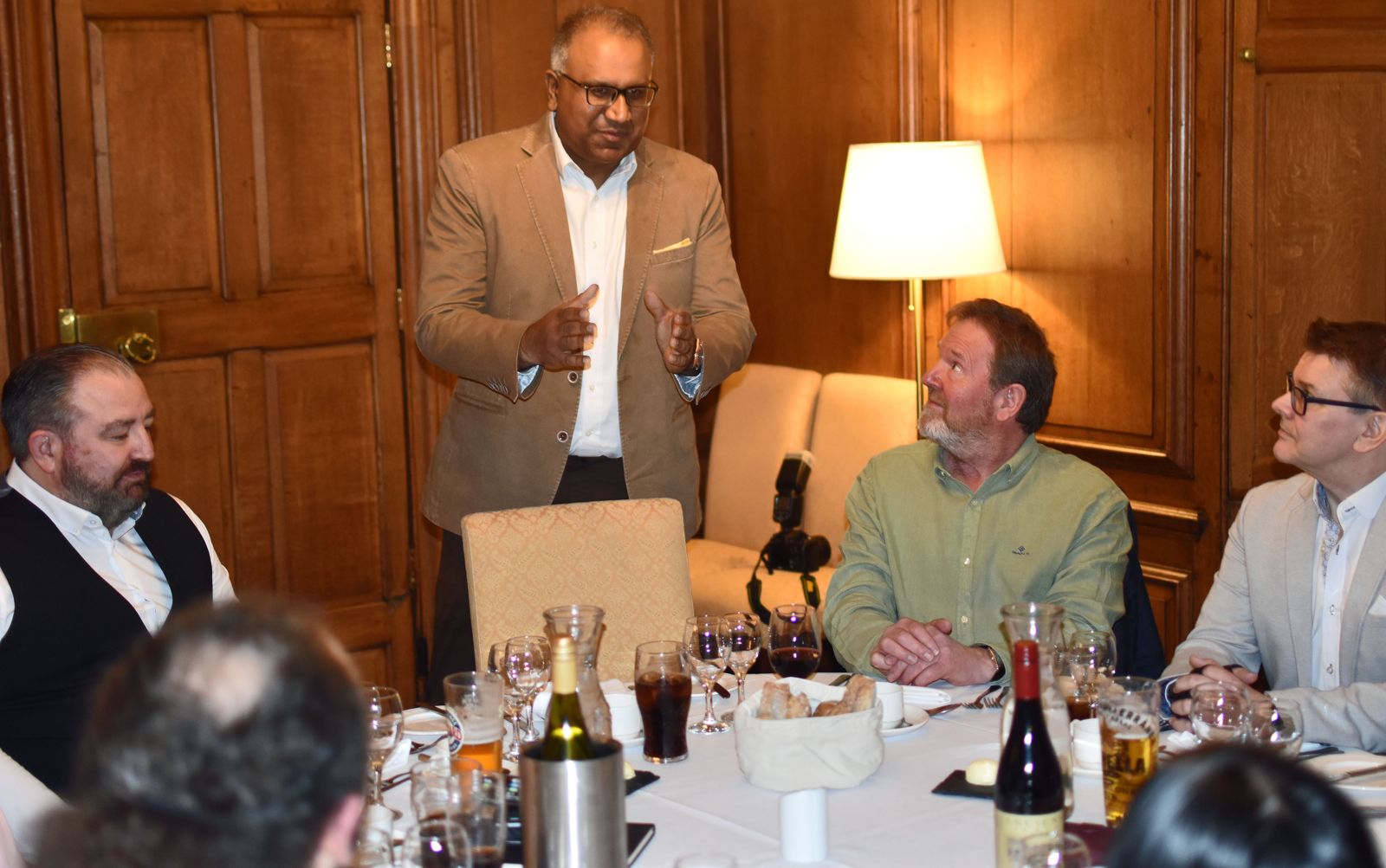 Safaraz Ali MBE speaking to guests at a business dinner