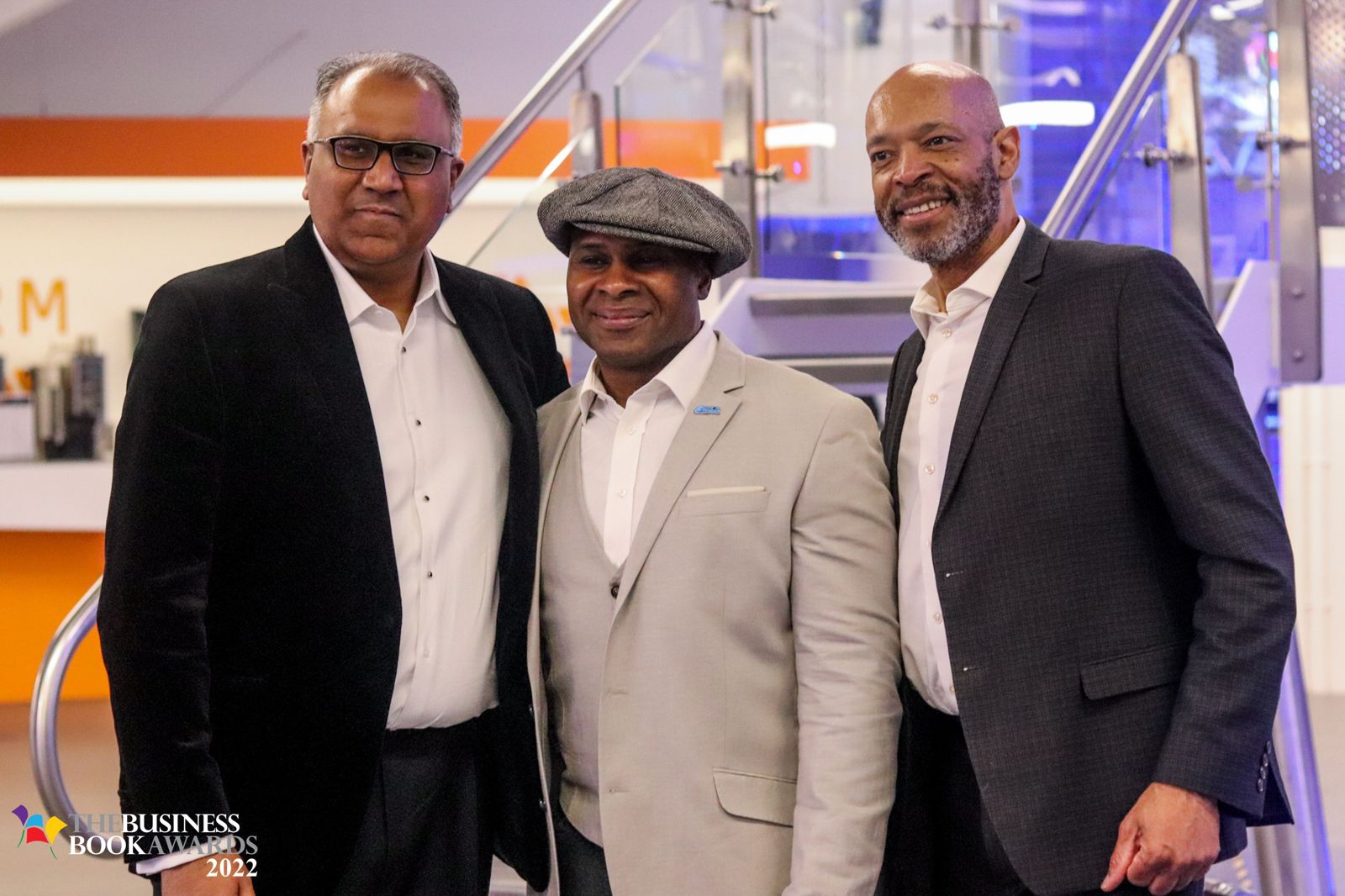 Safaraz Ali MBE with colleagues at a business event