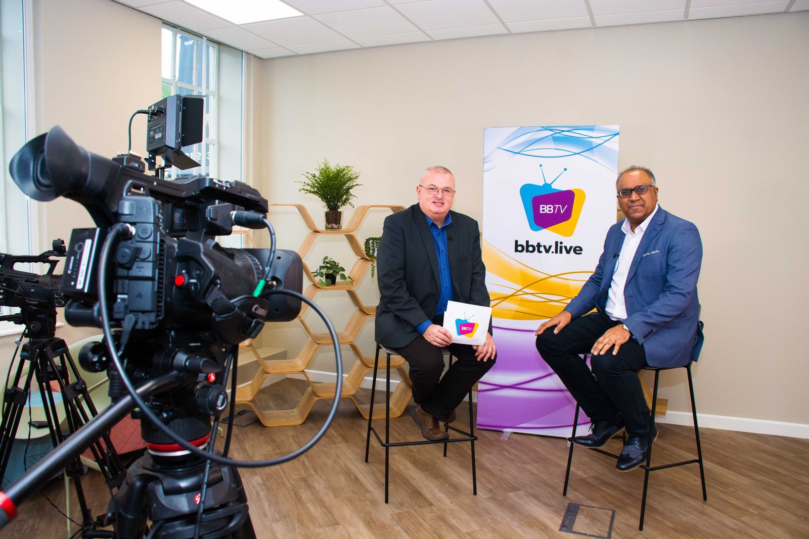 Safaraz Ali MBE being interviewed in a television studio
