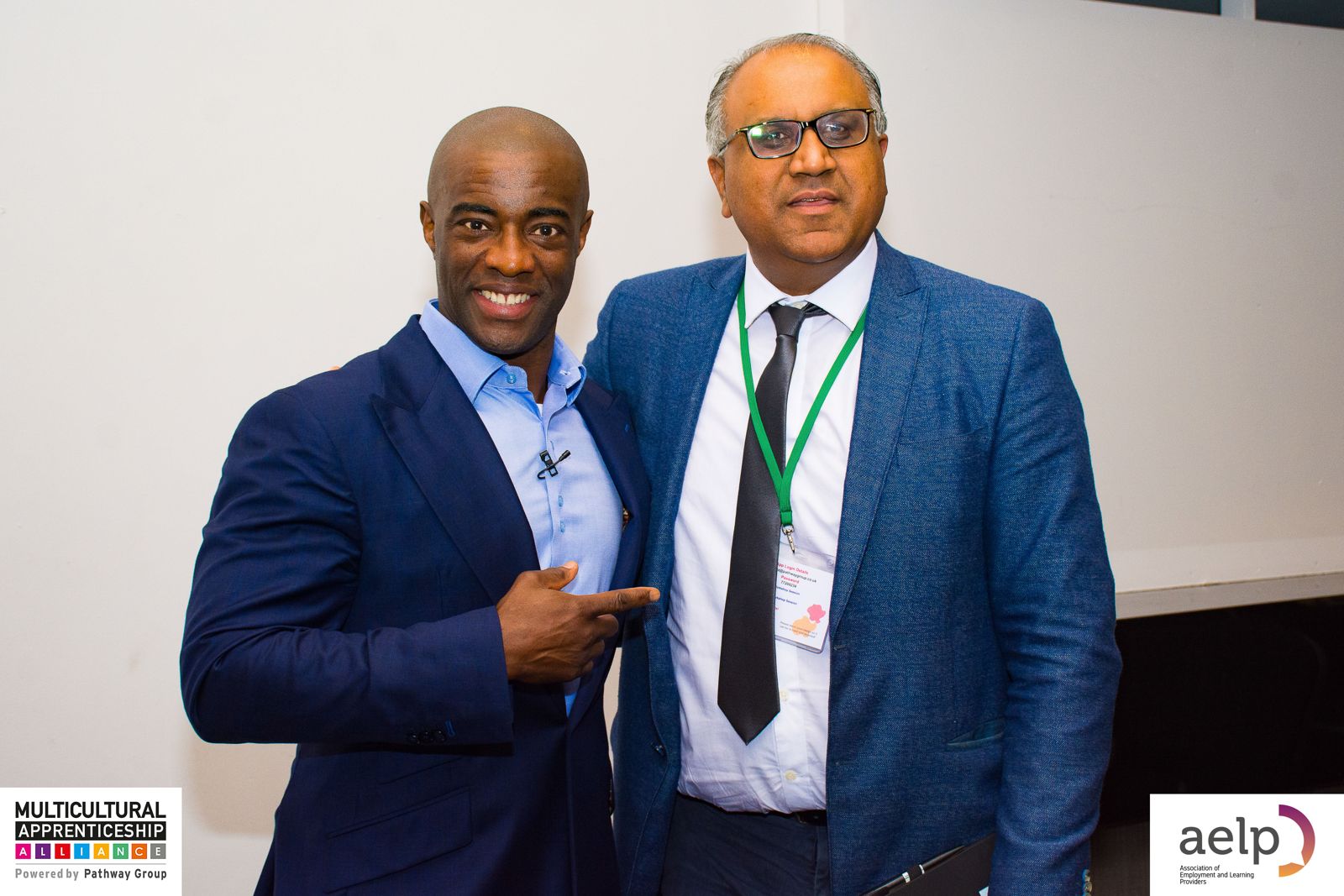 Safaraz Ali MBE with a guest speaker at an apprenticeship awards event