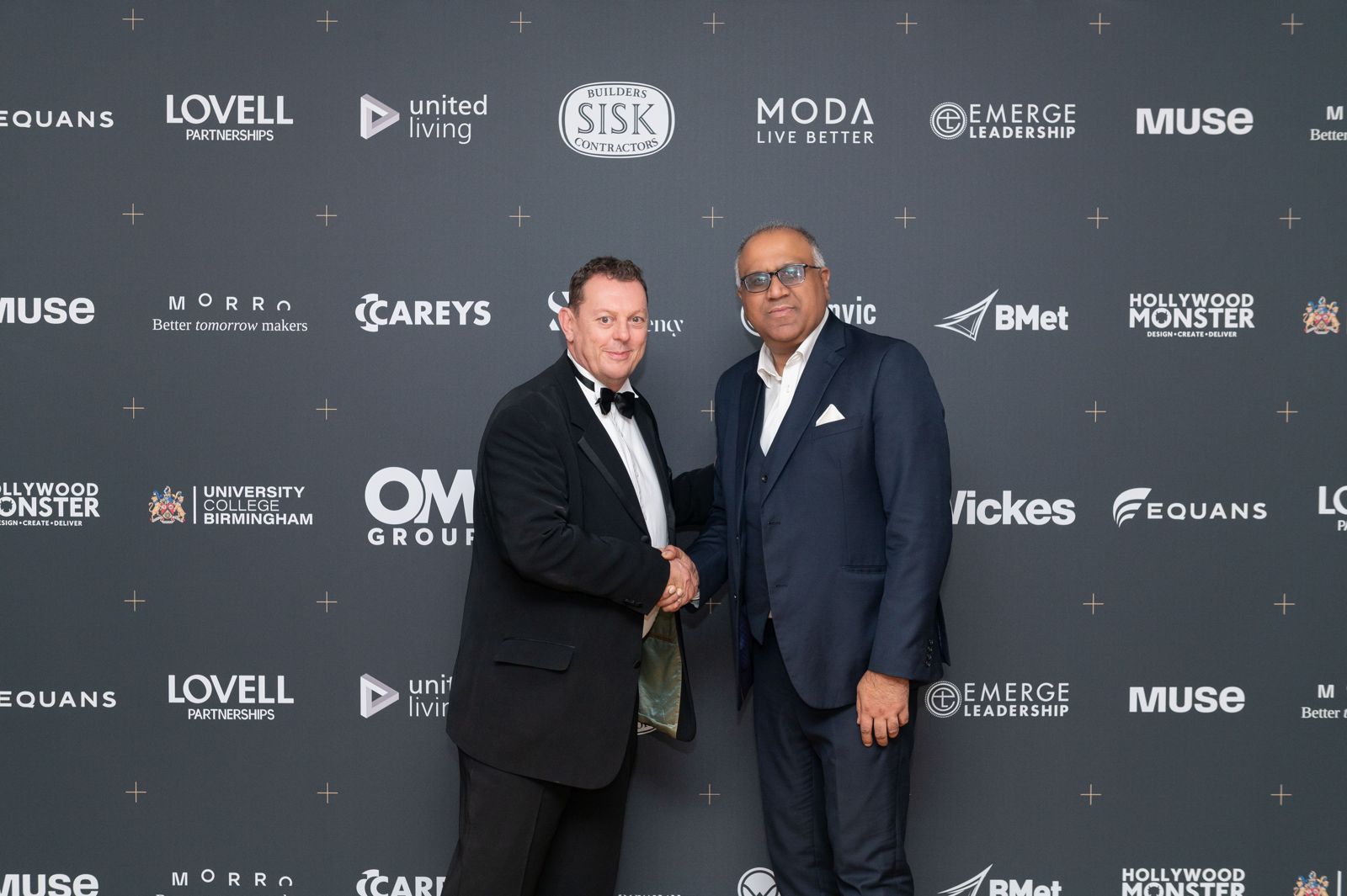 Safaraz Ali MBE shaking hands at an awards evening