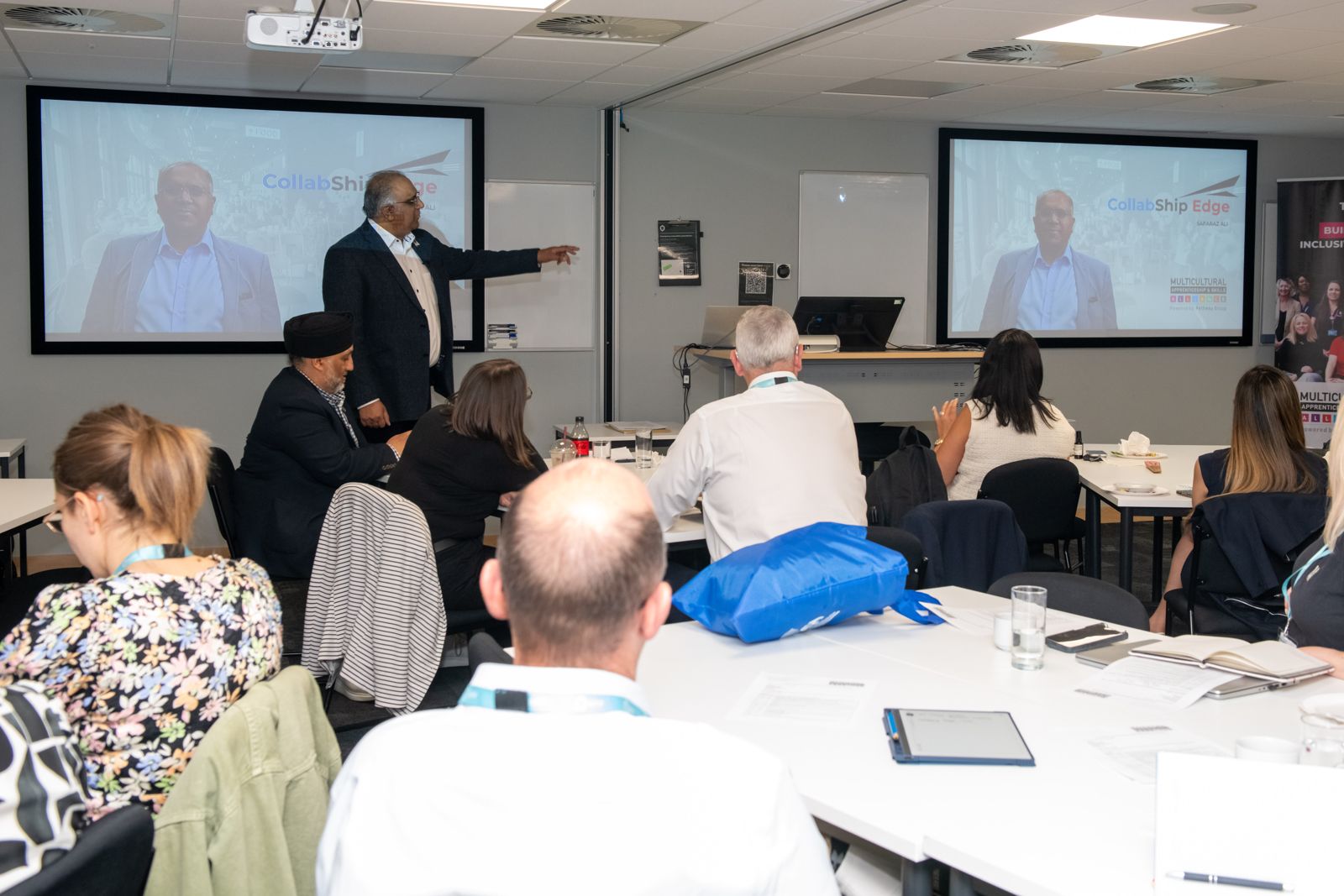 Safaraz Ali MBE presenting to a training room