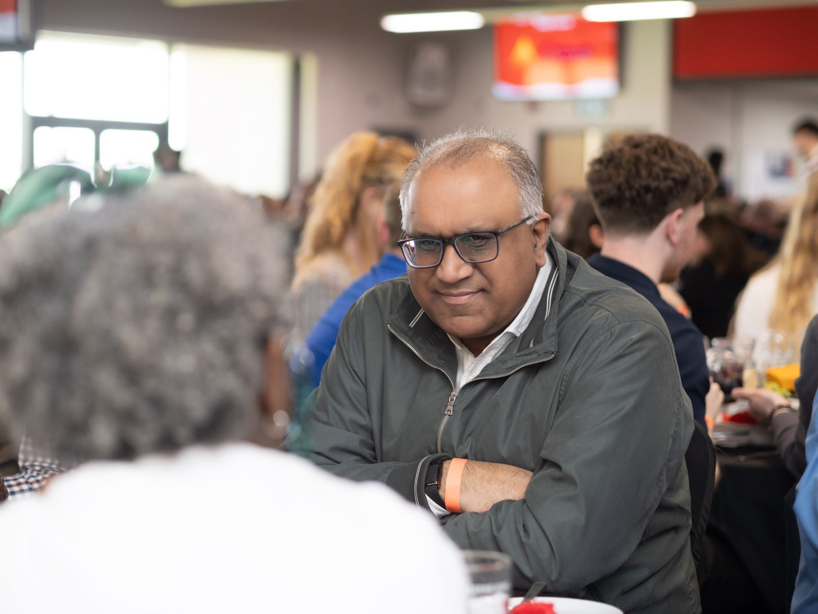 Safaraz Ali MBE chatting at a networking event